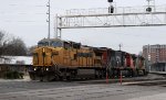 GECX 9513 leads train 6W4 across Cabarrus Street 